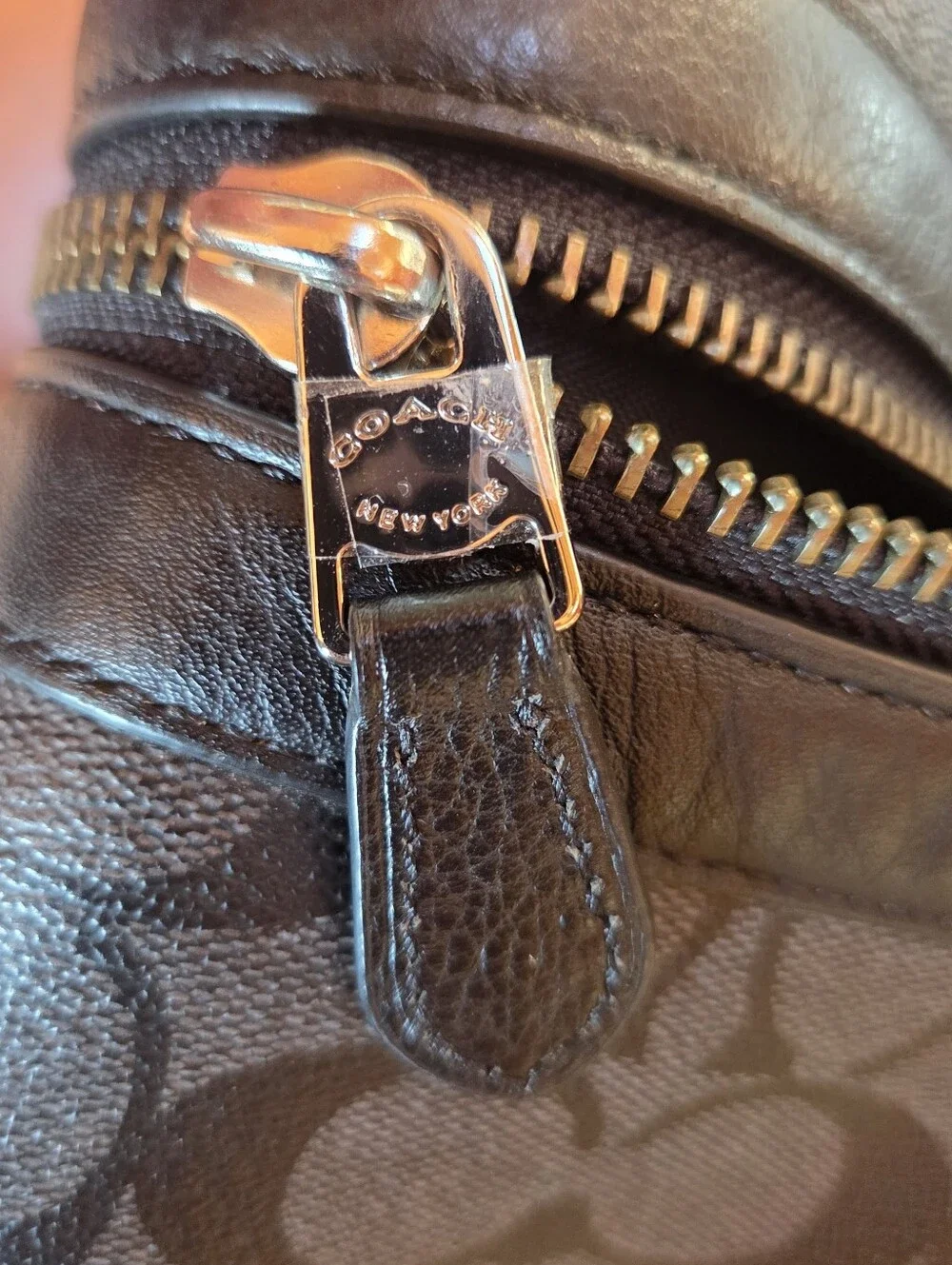 Coach Black Signature Leather Weekender tote bag dark gray and black.